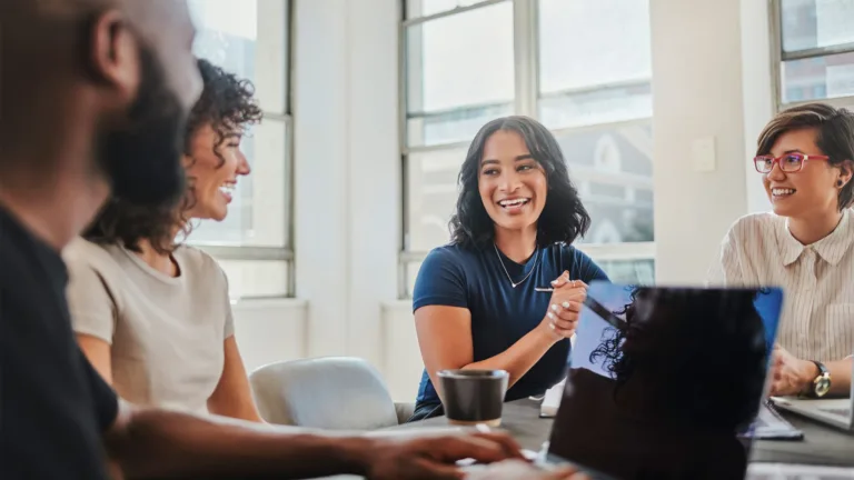 Happy coworkers in team meeting