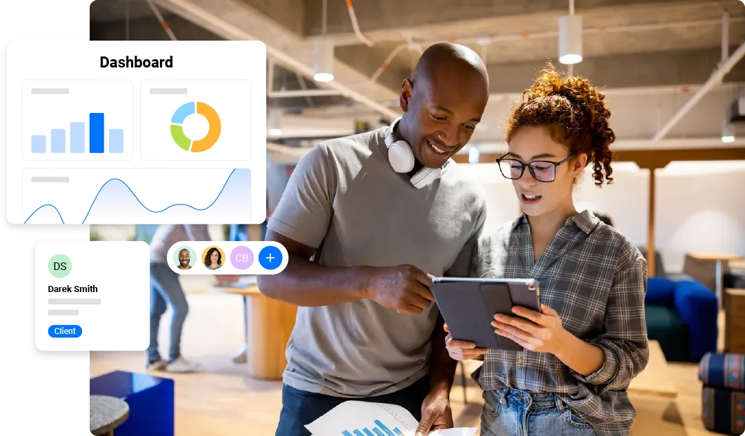 Small business owners viewing a digital marketing dashboard on tablet