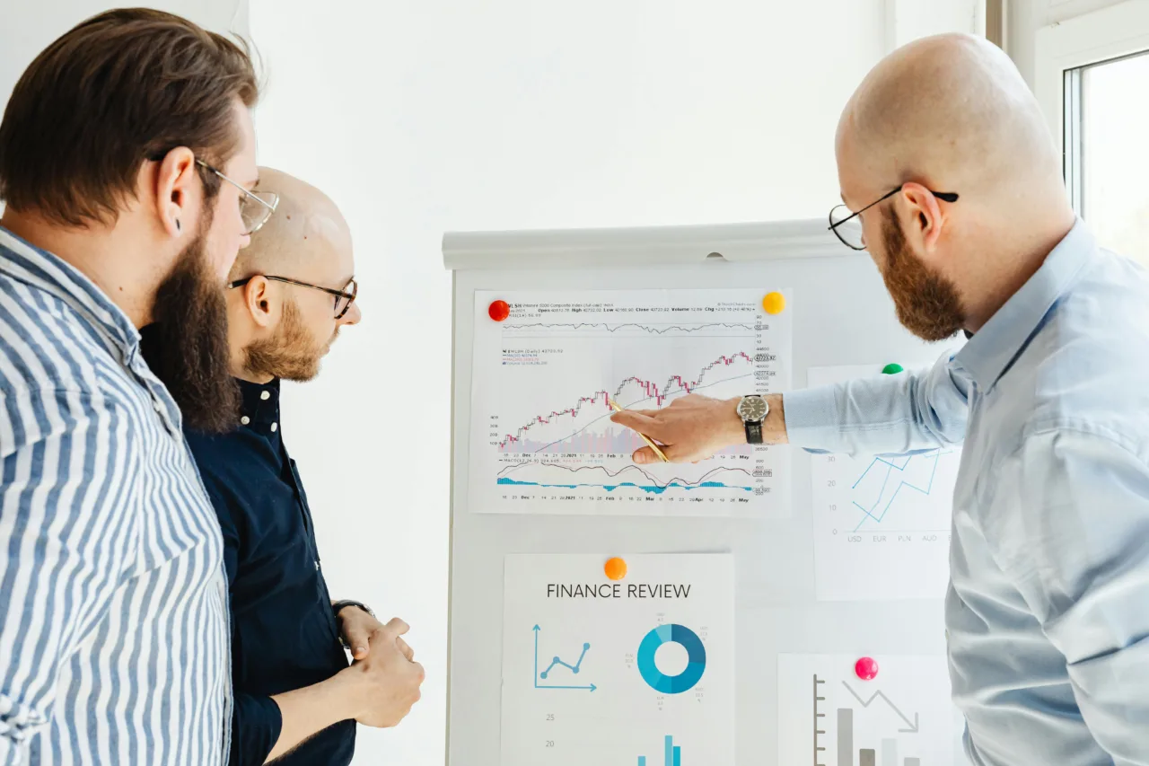 Business team reviewing charts during a strategy meeting