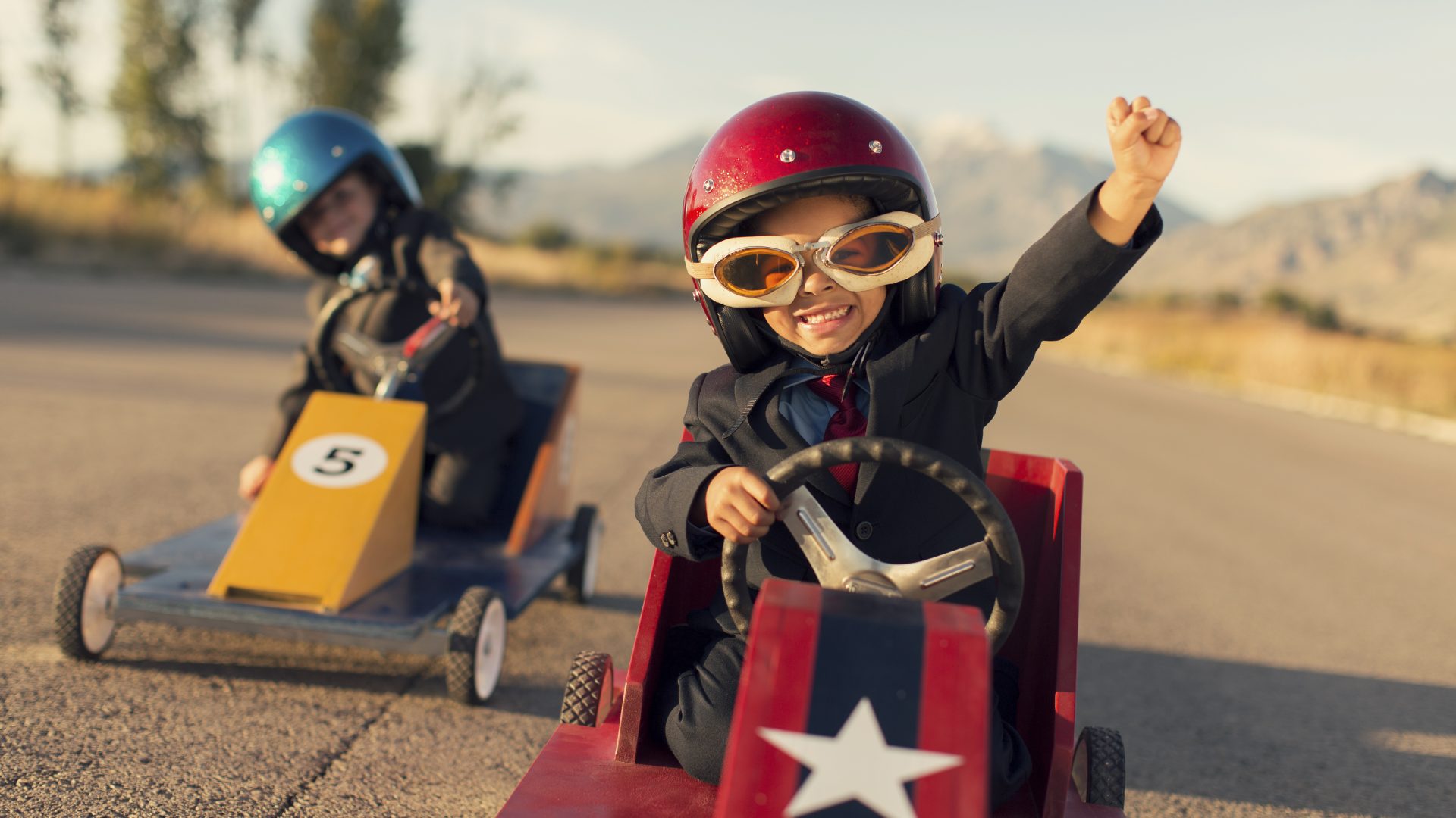 Young Business Boy Winning Car Race