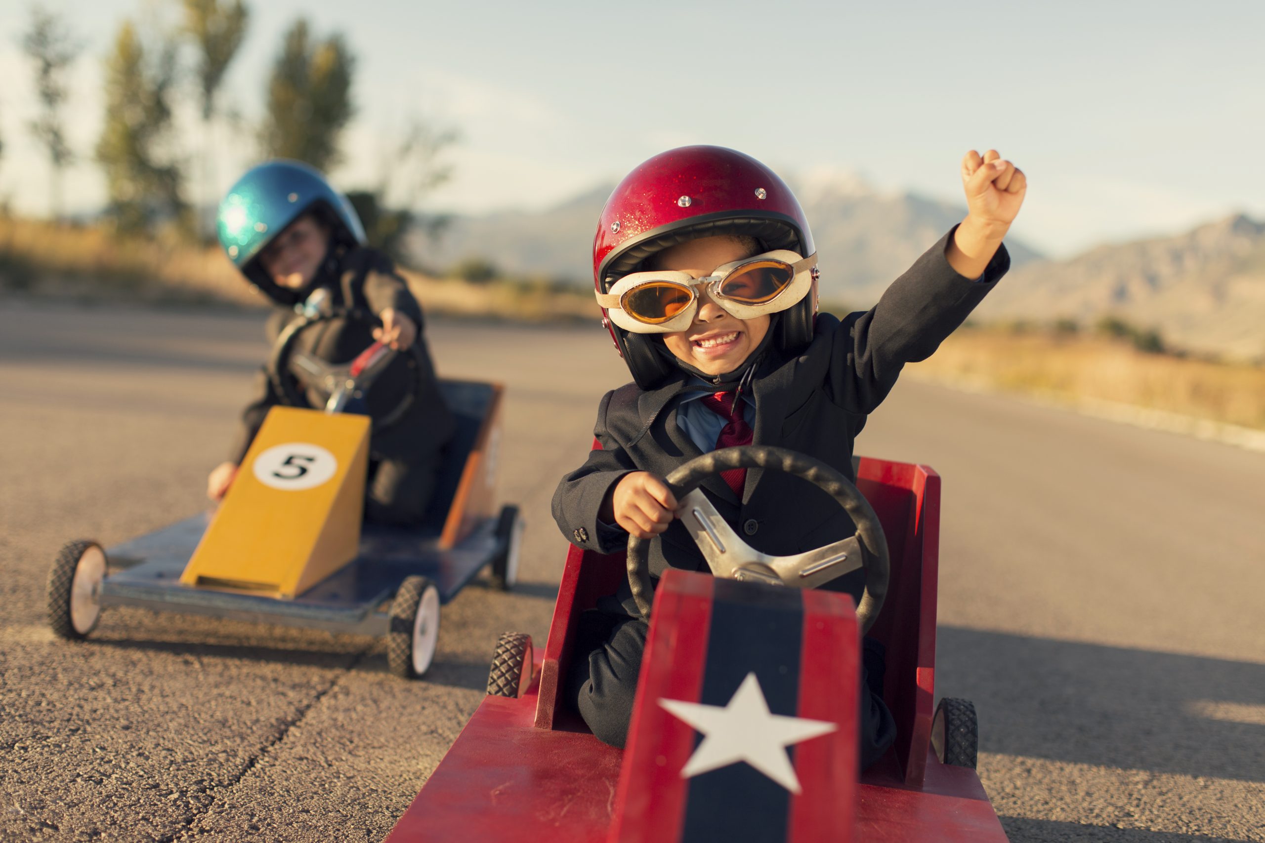 Young Business Boy Winning Car Race